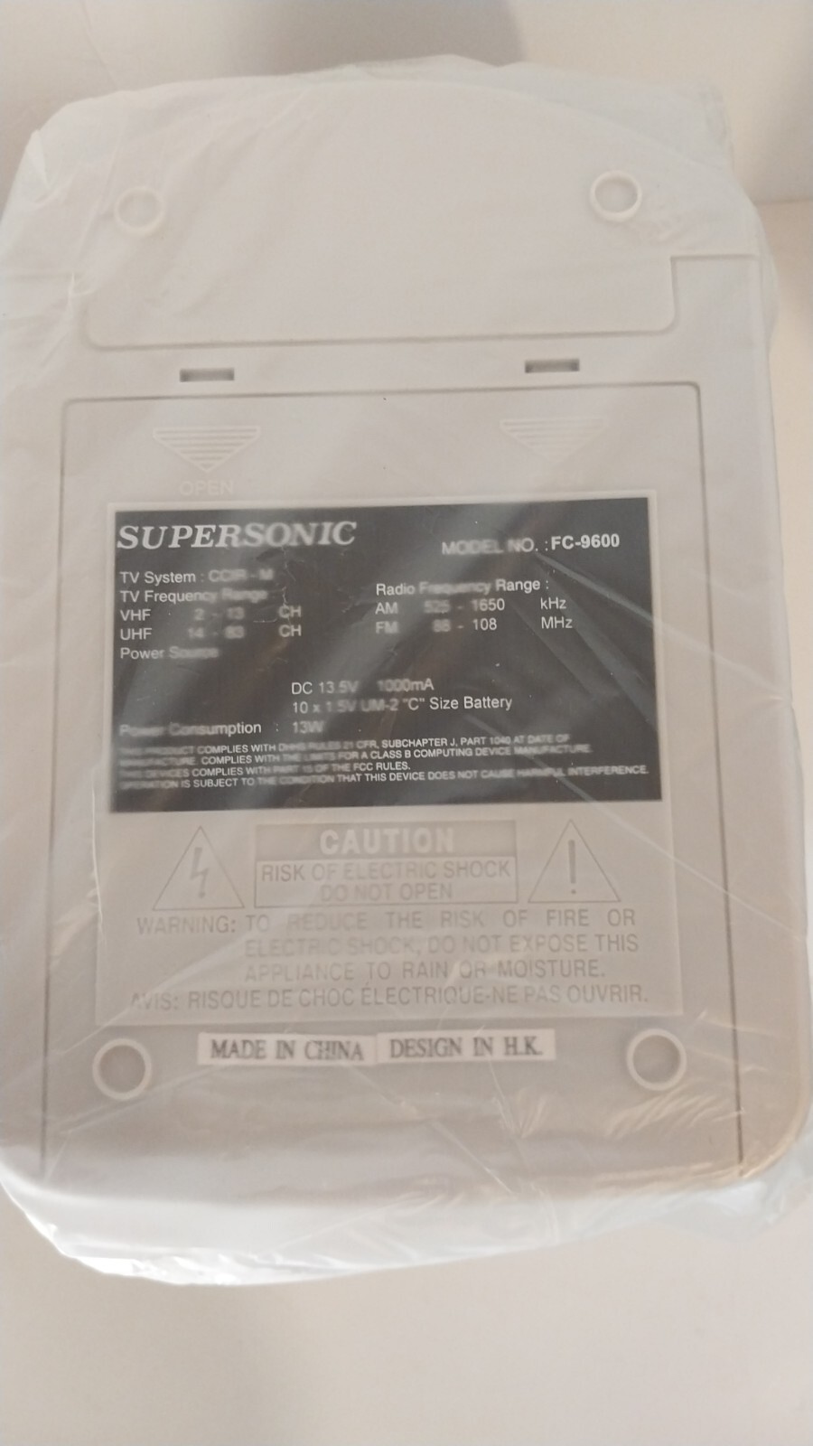 Figure 2i. Supersonic FC9600 - unboxed TV covered in plastic - bottom view of the factory sticker